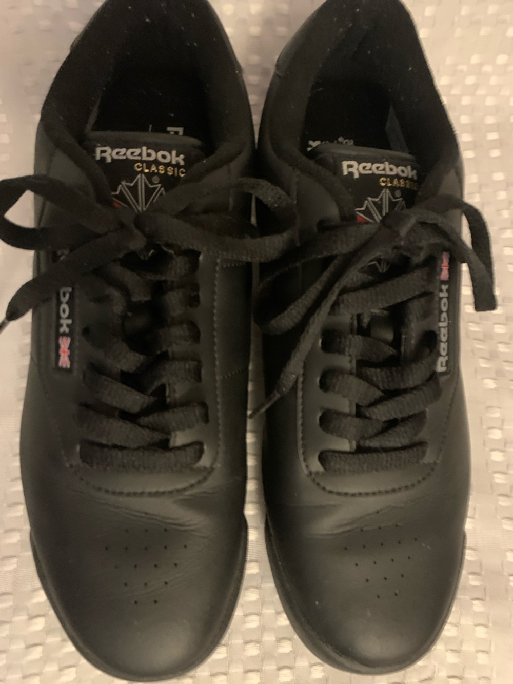 Reebok women’s Princess black leather low cut laced sneakers, size 9.